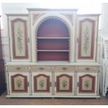 A Large Painted Dresser. 20th century. Decorated with panels of flowers on a cream ground. 204 x 214