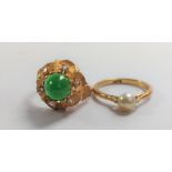 A gold colour metal ring set with a green cabochon stone and paste, size M, and an 18ct gold ring