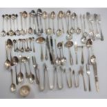 A collection of silver and silver-plated tea spoons, cake forks etc.