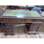 A reproduction mahogany Pedestal Desk. late 20th century. With leather inset top.