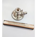 An antique silver plate chamber candlestick. Complete with snuffer and a slide rule.