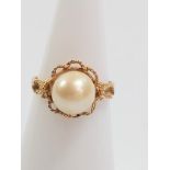 A ring marked for 18ct gold set single pearl. Size J