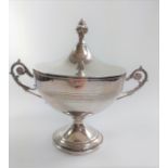 A silver two handled cup and cover.