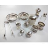 A collection of six glass and silver topped toilet bottles and a mixed collection of silver and