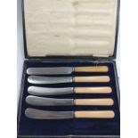 A Cased Set of 5 Tea Knives, one odd