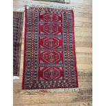 A Vintage Bokhara Rug. 139cm x 79cm.