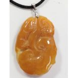 A carved jade pendant.