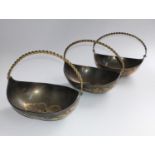 Three base metal baskets with gold colour inlay.