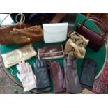 Nine vintage handbags and five pairs of gloves.