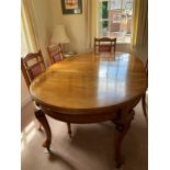 A Mid-20th century Dining table and eight chairs (Honduran mahogany). 190 x 119cm with an extra leaf