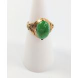 A 14k gold ring set with cabochon jade stone, size J.