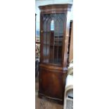 A dark mahogany veneer ornate vintage corner display cupboard. Approx.178cm x 62cm x 40cm
