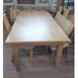 An extending oak kitchen table with 2 leaves, each adding an additional 40cm, and 6 chairs. 77cm x