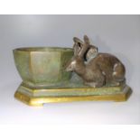 A French 19th century bronze of two rabbits next to a trough. 11cm long.