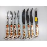 Four Royal Crown Derby knives and forks with pistol grip porcelain handles.