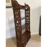 An Edwardian mahogany bookcase, four shelves and four drawers. 114cm x 54cm x 18cm