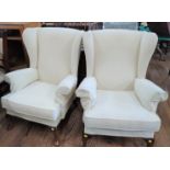 Two Parker Knoll wing-back chairs.