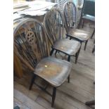 Three vintage wheel back chairs