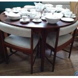 Extending circular dining table and 4 chairs. 74cm x 122cm.