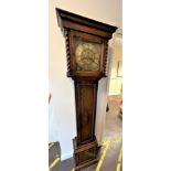A vintage oak longcase clock