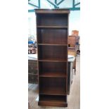 A narrow bookcase 162cm x 57cm x 27cm.