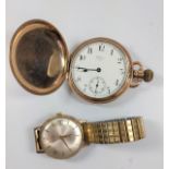 An American gold-plated Waltham Hunter watch A/F, and a 9ct gold Roamer Mans wristwatch on a metal