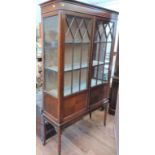 An Edwardian mahogany display cabinet. Circa 1905. 174cm x 100cm x 33cm.