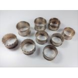 A collection of 9 miscellaneous silver napkin rings.