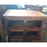 A TV stand, 20th century. Indian Rosewood, with one shelf for DVD player etc. and cupboard space