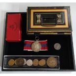 A Queen Elizabeth II 1953 Coronation medal, designed by Cecil Thomas with ribbon, in original red