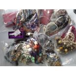 Five bags of miscellaneous costume jewellery