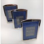 Three matching Sterling silver photo frames size 10cm x 15cm with boxes.