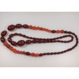 Two strings of possibly amber beads.
