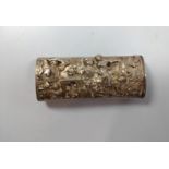 A white metal match case with tavern scene and striker