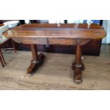 A Rosewood centre table with two drawers set on pillar legs. Circa 1830. 73cm x 137cm x 70cm