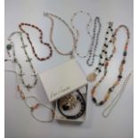 Ten beaded costume necklaces including boxed Leo Sands Lion necklace.