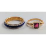 A gold colour ring set with a red stone (possibly) ruby, size F, and a ring set with blue beads