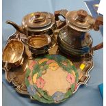 A silver-plated tea set on silver-plated tray, plus five cloth doilies.