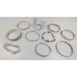 Ten silver bangles