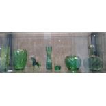 Seven green glass items including a horse and a snail. (7)