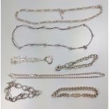 An assortment of four silver bracelets and three silver necklaces