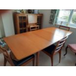 A 1960's dining table (74cm x 148cm x 84cm) and 4 ladderback chairs