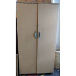 Two-door filing cabinet, light wood.