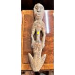 A Vintage West African Ancestor Figure. Shows signs of paint. 62cm long.