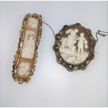 A shell cameo depicting two plaques of flowers and a troubadour playing his lute. Another cameo