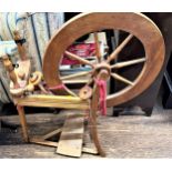 A Vintage/Antique Spinning Wheel and book. Provenance, 80 Rose Street Wokingham.