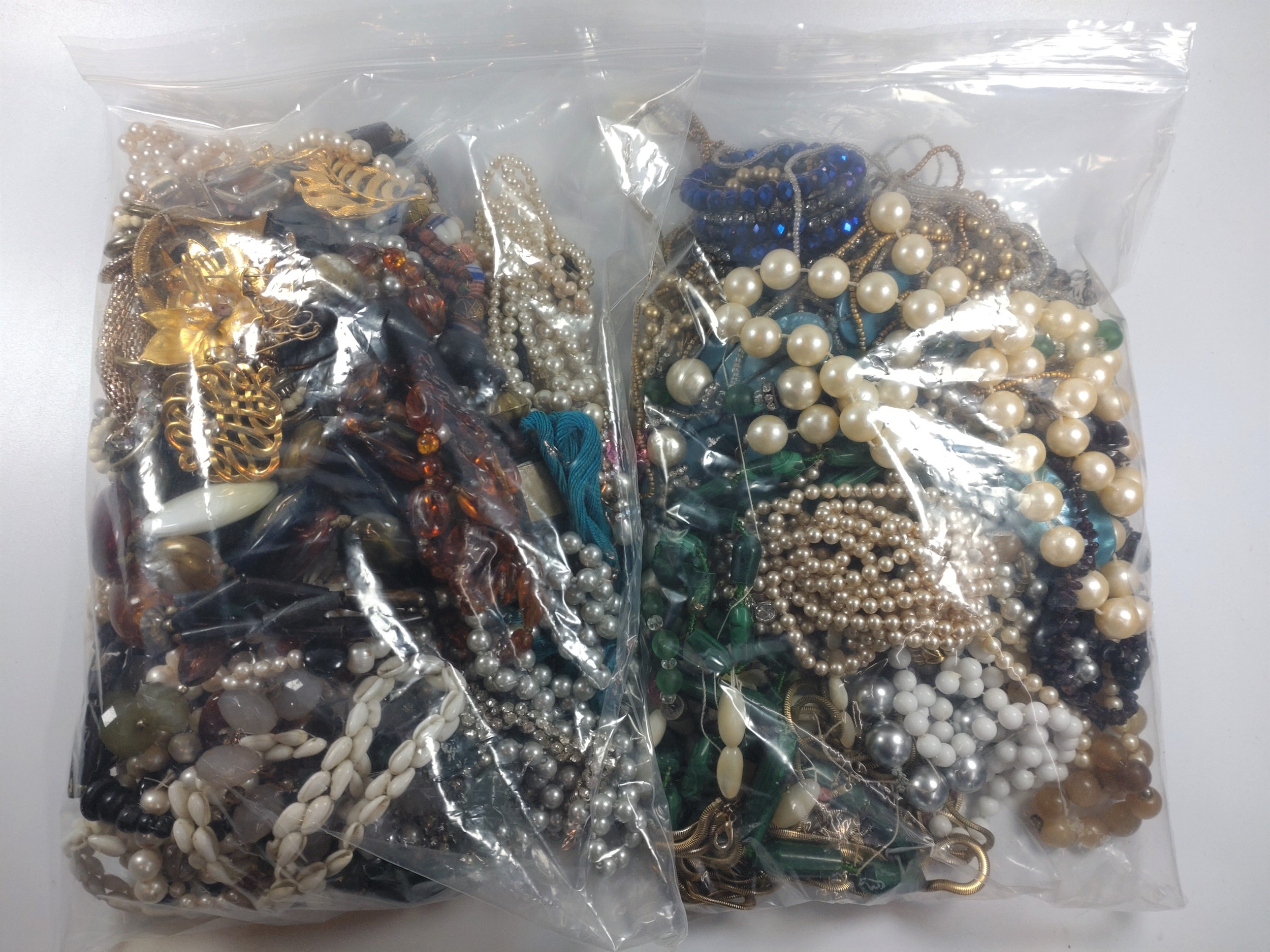 Two large bags of costume jewellery. provenance 80 Rose Street Wokingham.