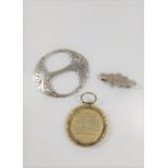 A George III gold colour metal photo frame AF and a silver brooch, plus a silver name brooch "