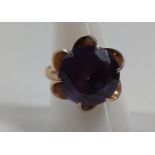 A gold ring marked 14k set with a possible amethyst. Size R. Provenance 80 Rose Street Wokingham.