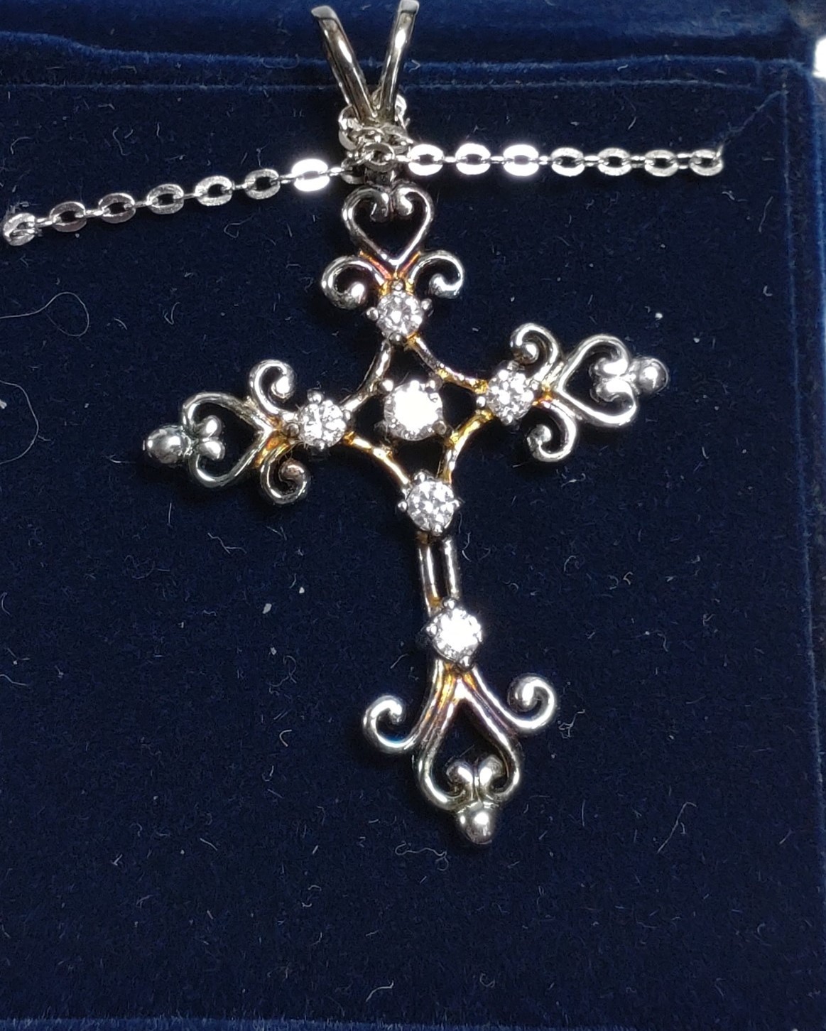 A collection of four silver and coin set crucifix pendants, three with silver chains. - Image 3 of 5